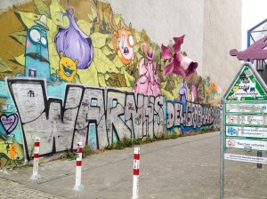 elaborate graffiti adorns a random alley in berlin, germany